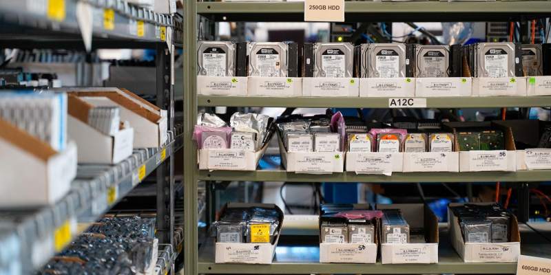 obsolete hard drives stacked on shelves