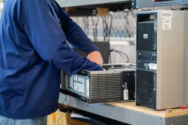 technician removing hard drives