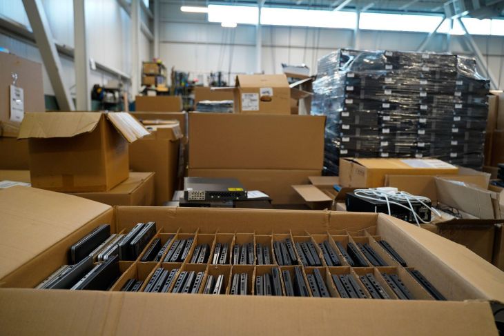 boxes of laptops and other obsolete IT assets for disposal