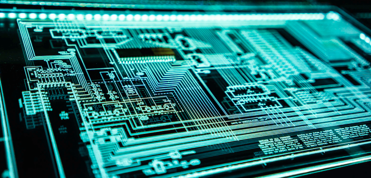 Close-up of a complex, glowing circuit board with intricate pathways and numerous components, illustrating the benefits of technological assets against a dark background.