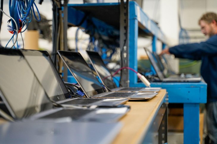 checking obsolete laptops in a warehouse