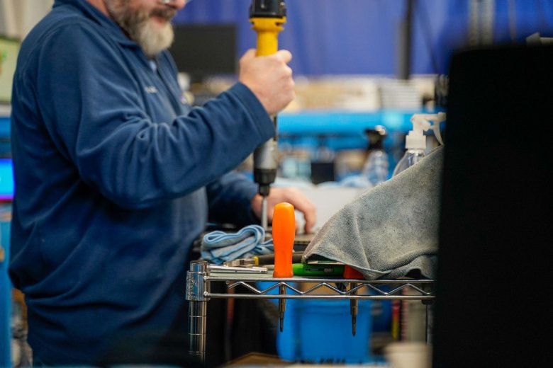 technician working with tools in a warehouse